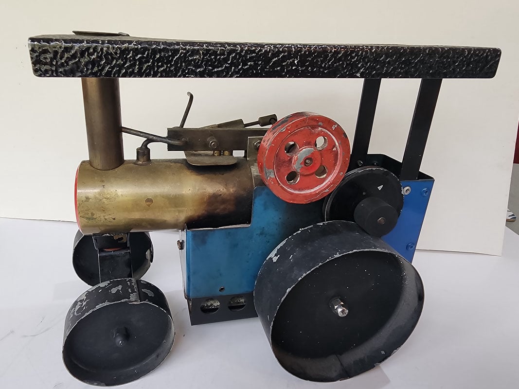 Example of a early David Auls traction engine with sheet metal wheels